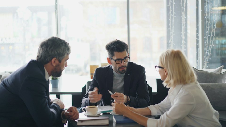 Advisors in a meeting with a client