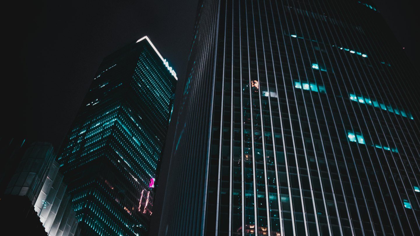 Office towers seen from below at night